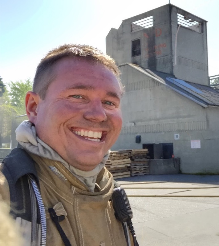 Sean Wood in firefighter gear at training tower